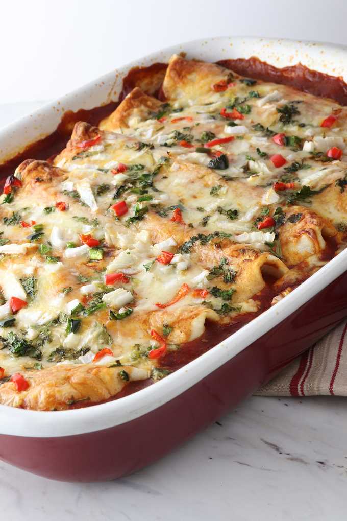 a baking dish of turkey enchiladas