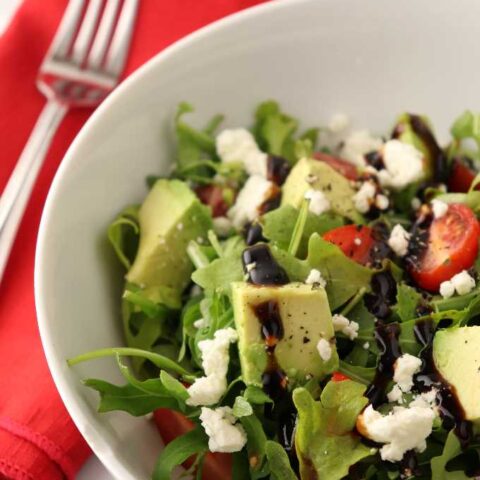 Arugula salad with feta cheese and balsamic glaze