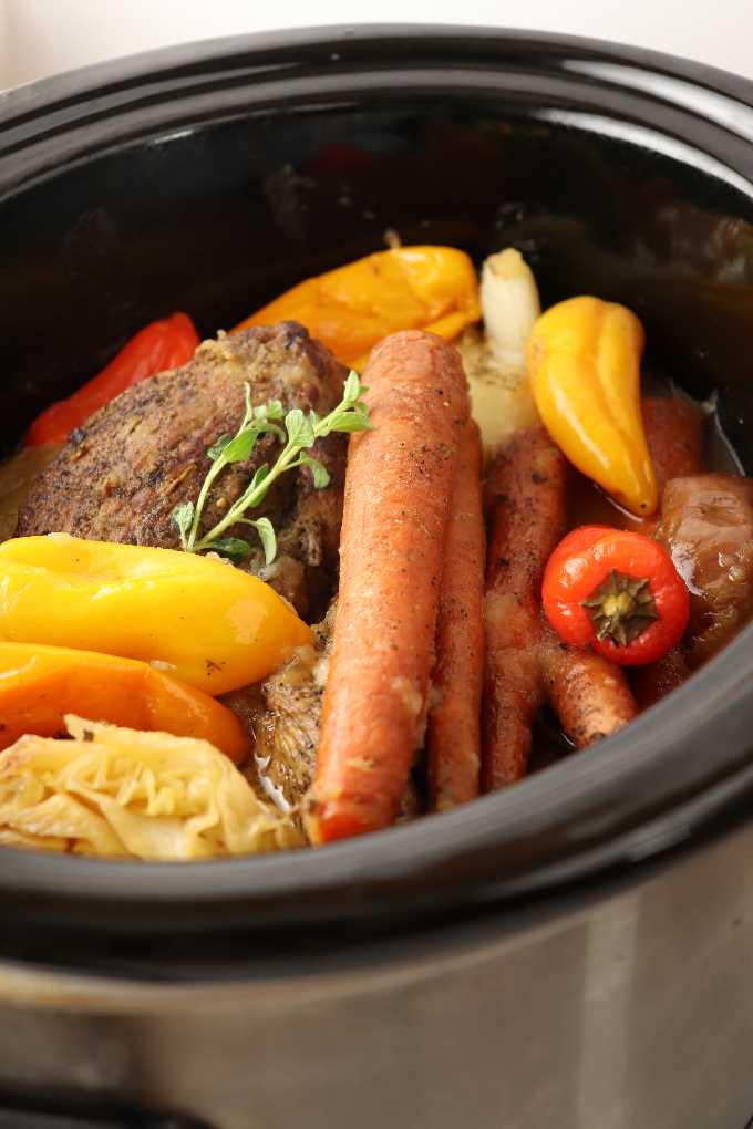 Pork roast with vegetables in a slow cooker