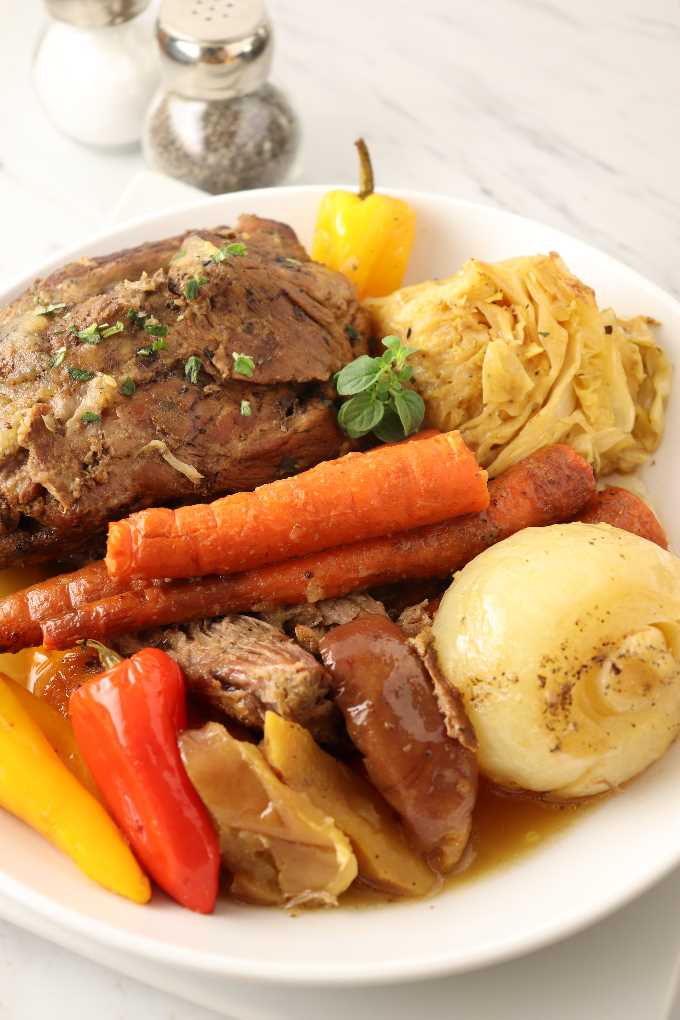Pork roast with vegetables on a plate